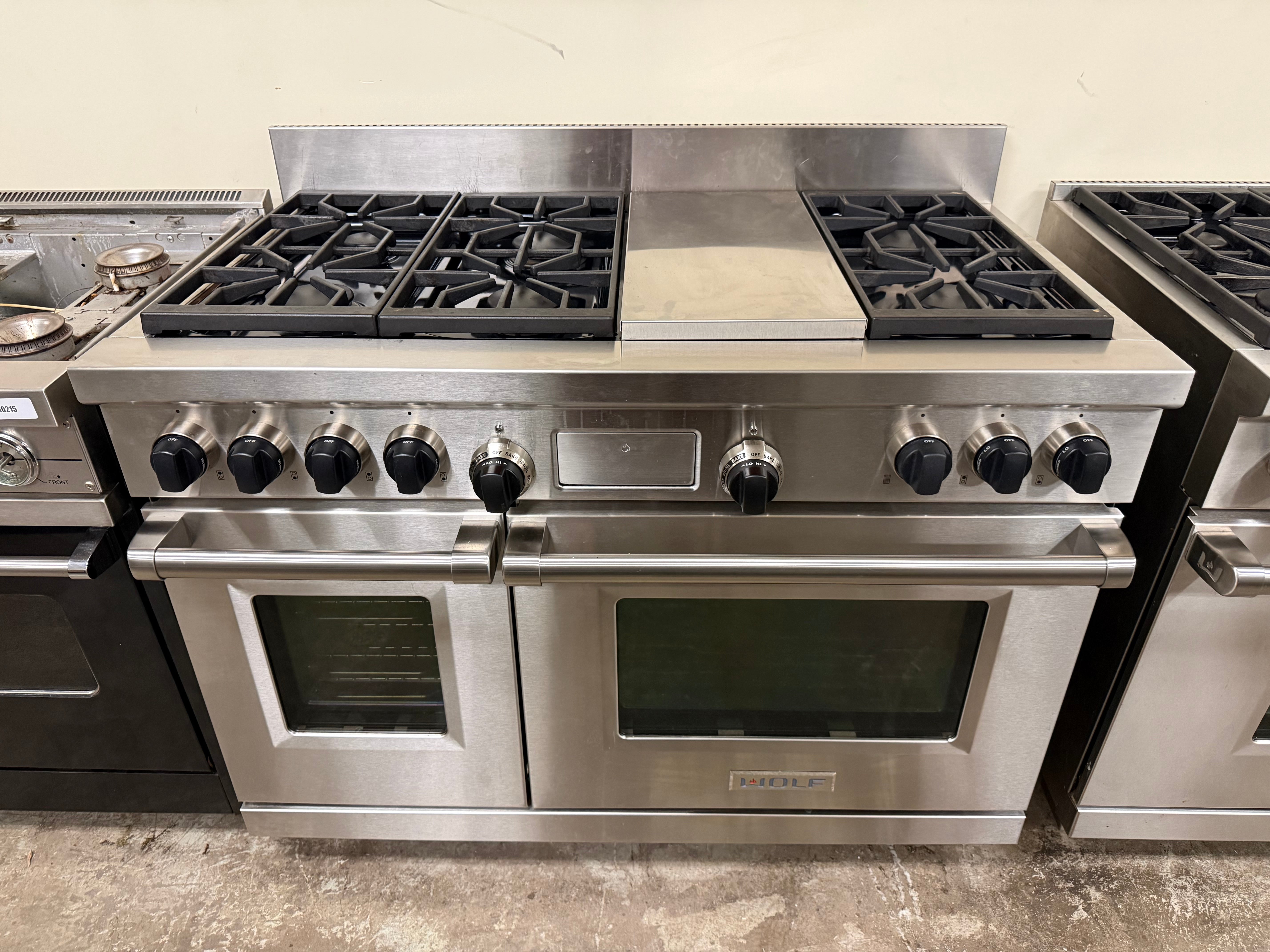 Wolf DF486C 48 inch professional dual fuel range front view stainless steel with iconic black knobs