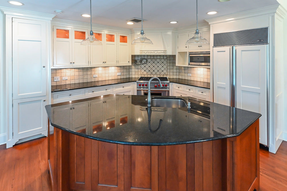 Custom Traditional White Kitchen with Wood Island, Granite Countertops and Wolf Range