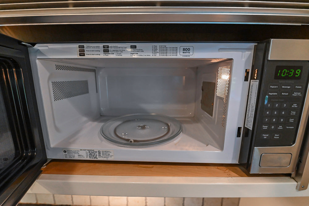 Custom Traditional White Kitchen with Wood Island, Granite Countertops and Wolf Range