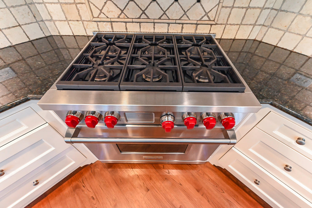 Custom Traditional White Kitchen with Wood Island, Granite Countertops and Wolf Range