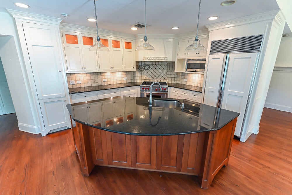 Custom Traditional White Kitchen with Wood Island, Granite Countertops and Wolf Range