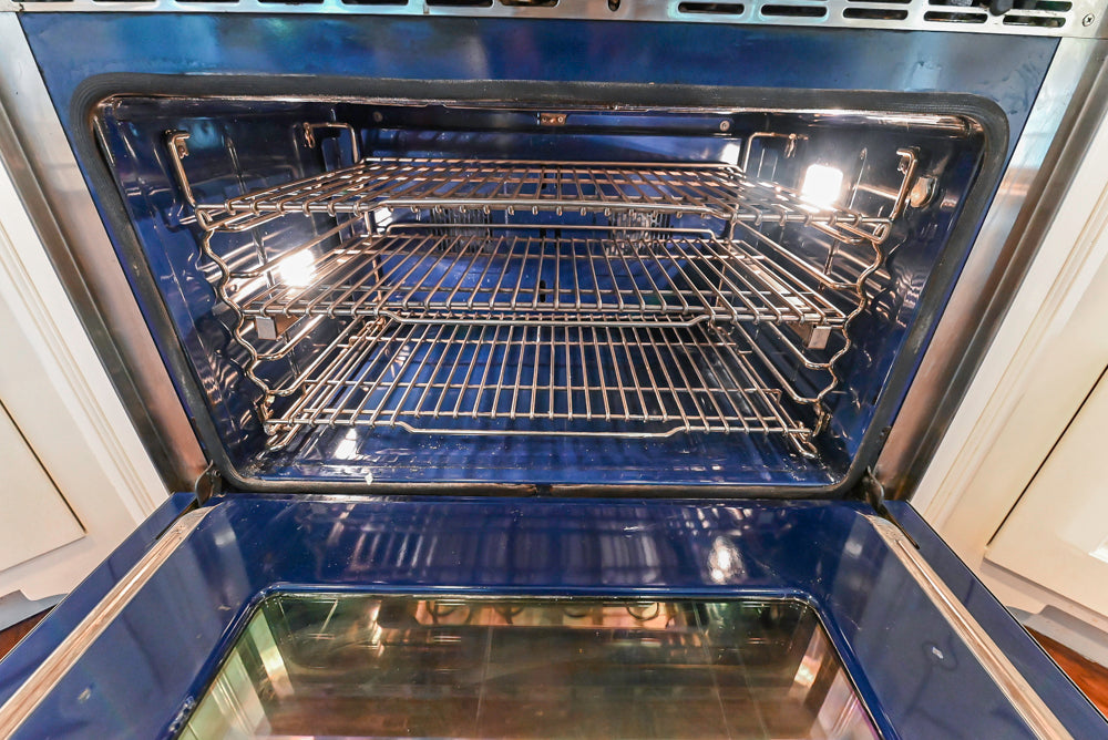Custom Traditional White Kitchen with Wood Island, Granite Countertops and Wolf Range
