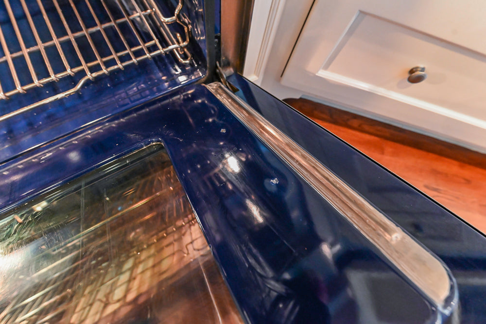 Custom Traditional White Kitchen with Wood Island, Granite Countertops and Wolf Range