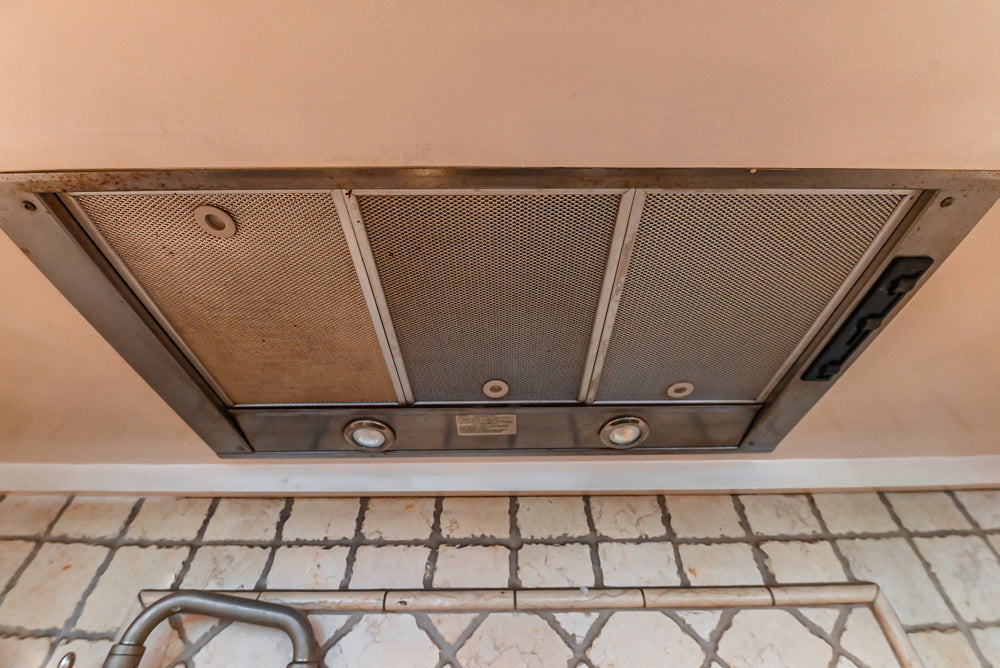 Custom Traditional White Kitchen with Wood Island, Granite Countertops and Wolf Range