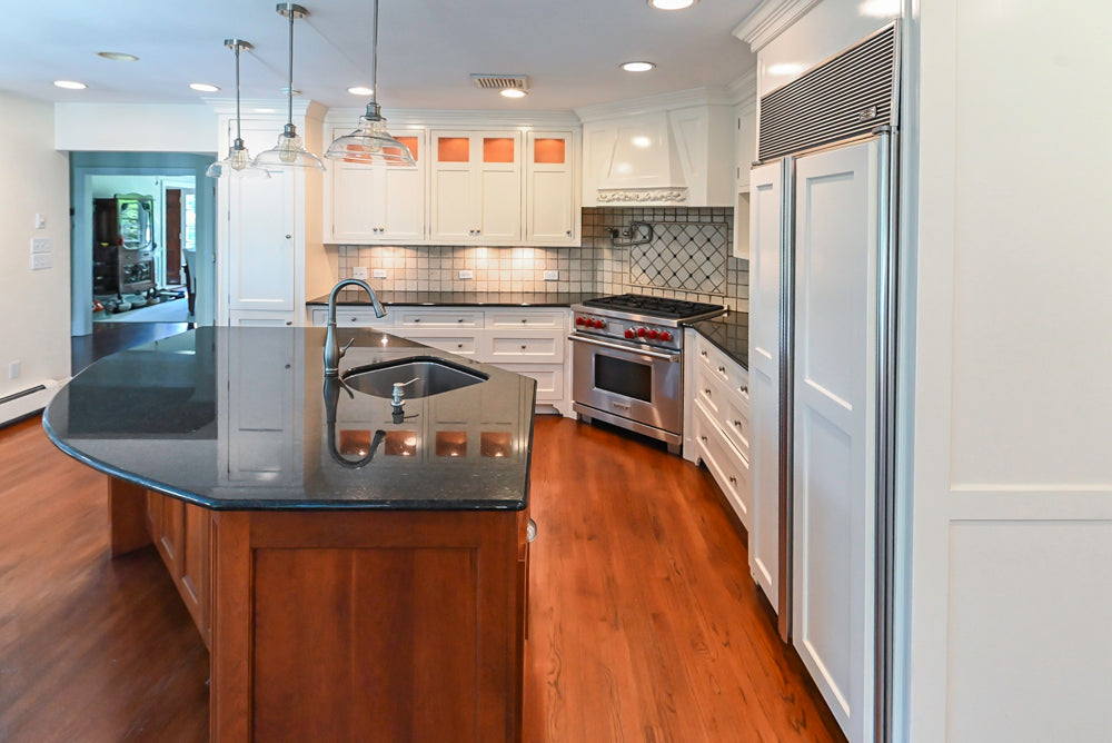 Custom Traditional White Kitchen with Wood Island, Granite Countertops and Wolf Range