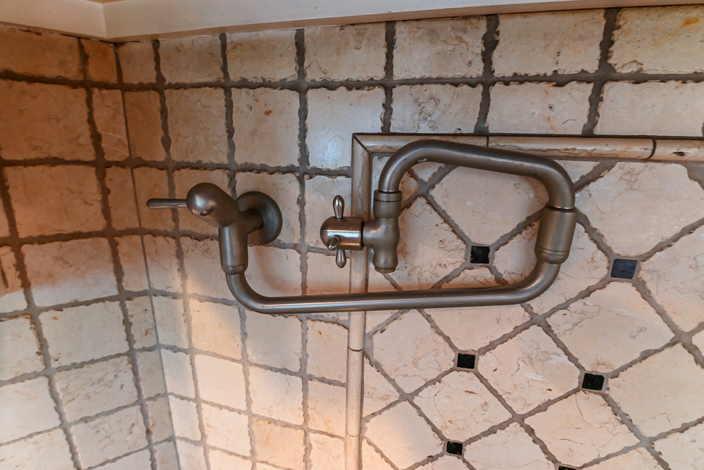 Custom Traditional White Kitchen with Wood Island, Granite Countertops and Wolf Range
