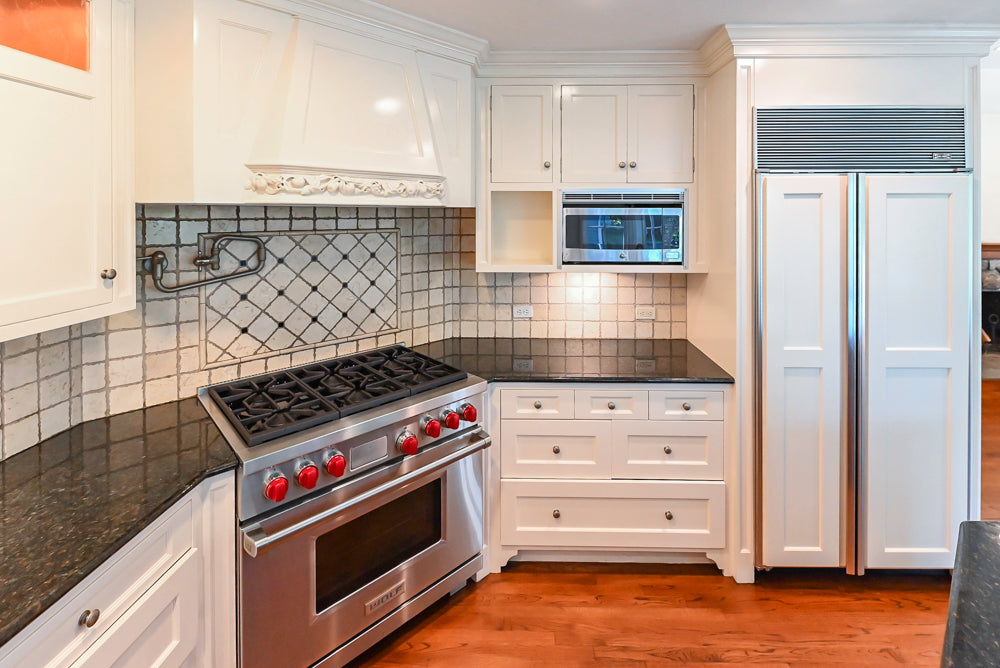 Custom Traditional White Kitchen with Wood Island, Granite Countertops and Wolf Range