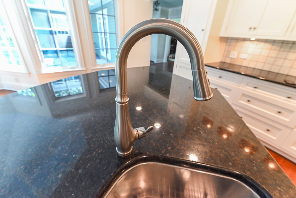 Custom Traditional White Kitchen with Wood Island, Granite Countertops and Wolf Range