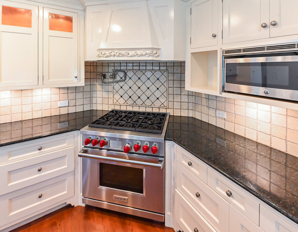Custom Traditional White Kitchen with Wood Island, Granite Countertops and Wolf Range