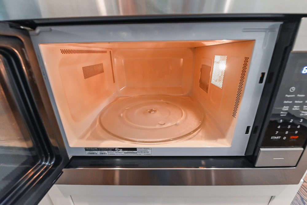 Fabuwood Transitional White Kitchen with Island and White Marble Countertops