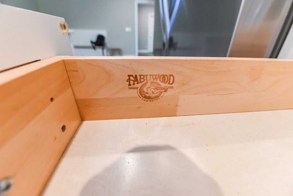 Fabuwood Transitional White Kitchen with Island and White Marble Countertops