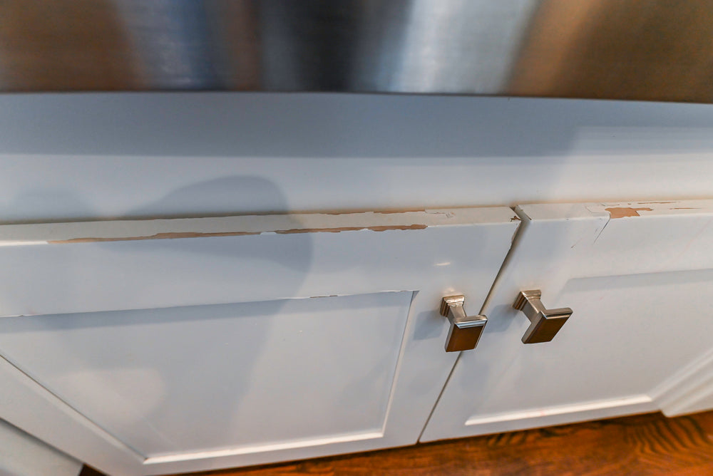 Fabuwood Transitional White Kitchen with Island and White Marble Countertops