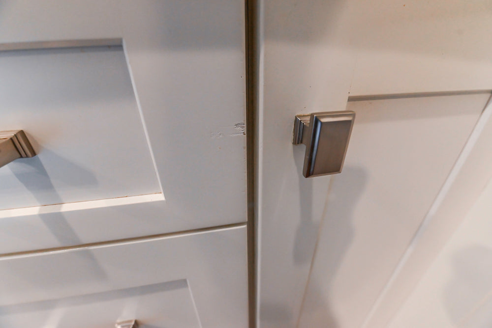 Fabuwood Transitional White Kitchen with Island and White Marble Countertops