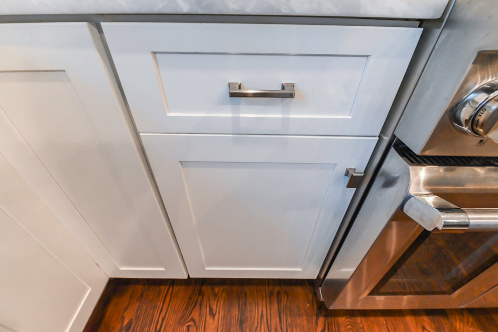 Fabuwood Transitional White Kitchen with Island and White Marble Countertops
