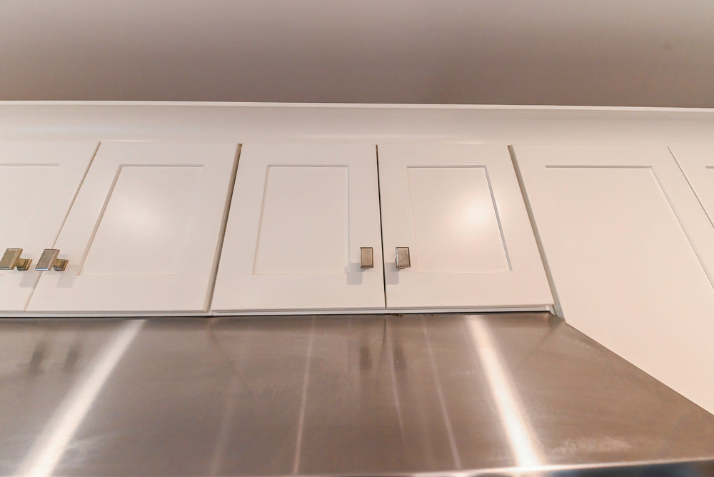 Fabuwood Transitional White Kitchen with Island and White Marble Countertops