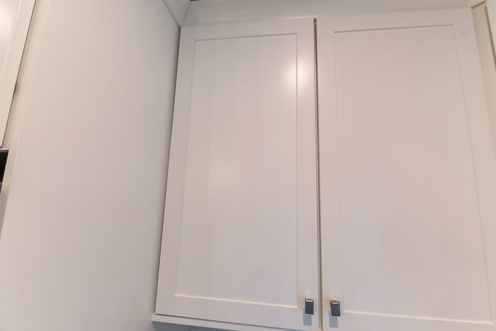 Fabuwood Transitional White Kitchen with Island and White Marble Countertops