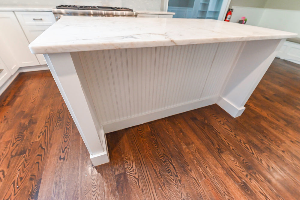 Fabuwood Transitional White Kitchen with Island and White Marble Countertops