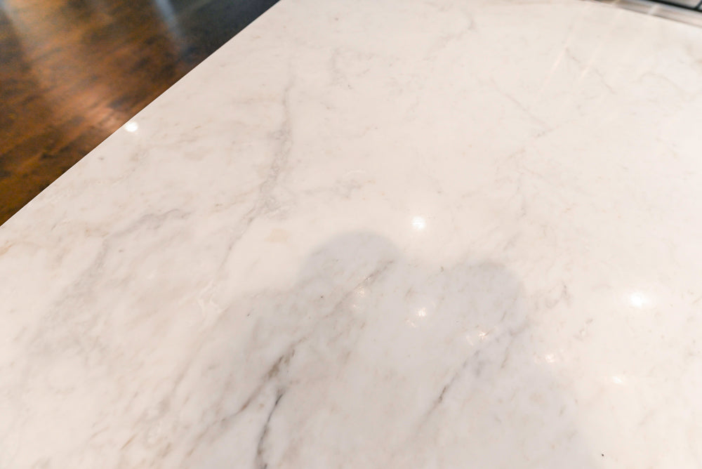 Fabuwood Transitional White Kitchen with Island and White Marble Countertops