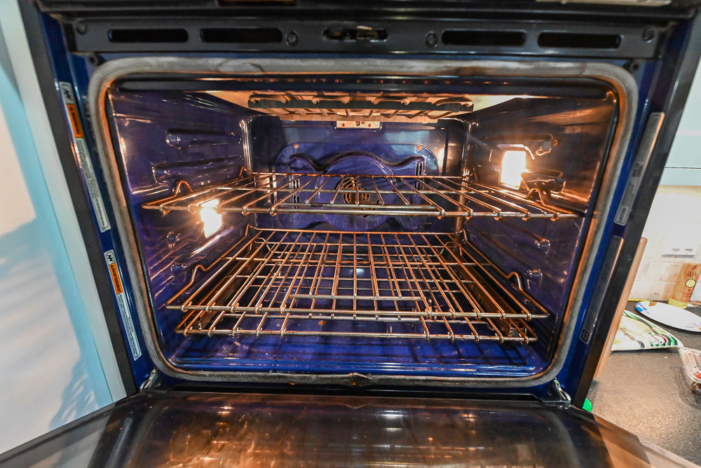 Custom Traditional White Kitchen with Stone Countertops and Appliances