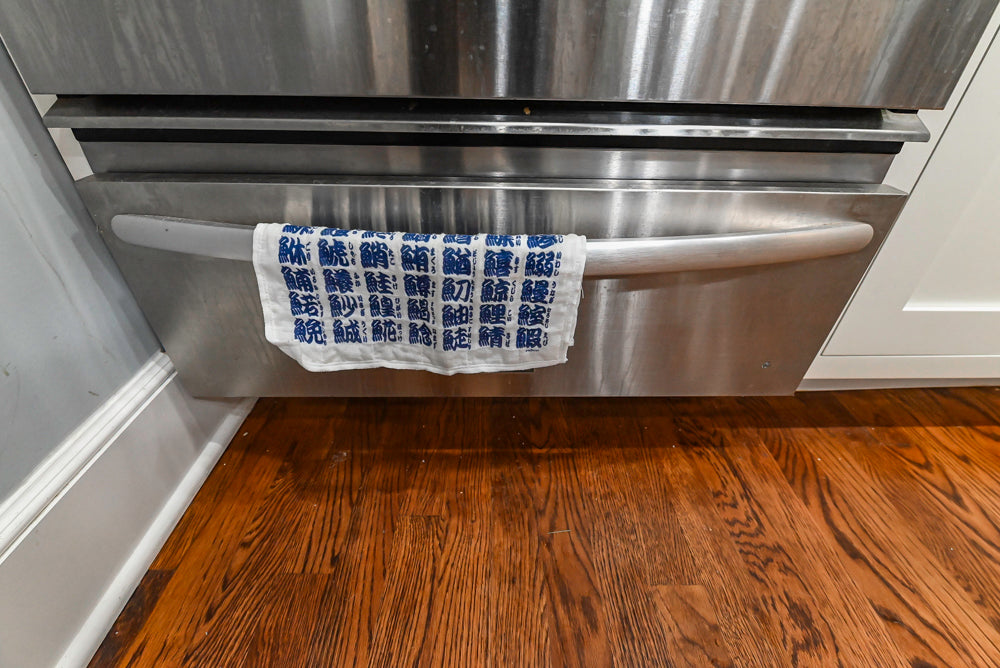 Custom Traditional White Kitchen with Stone Countertops and Appliances