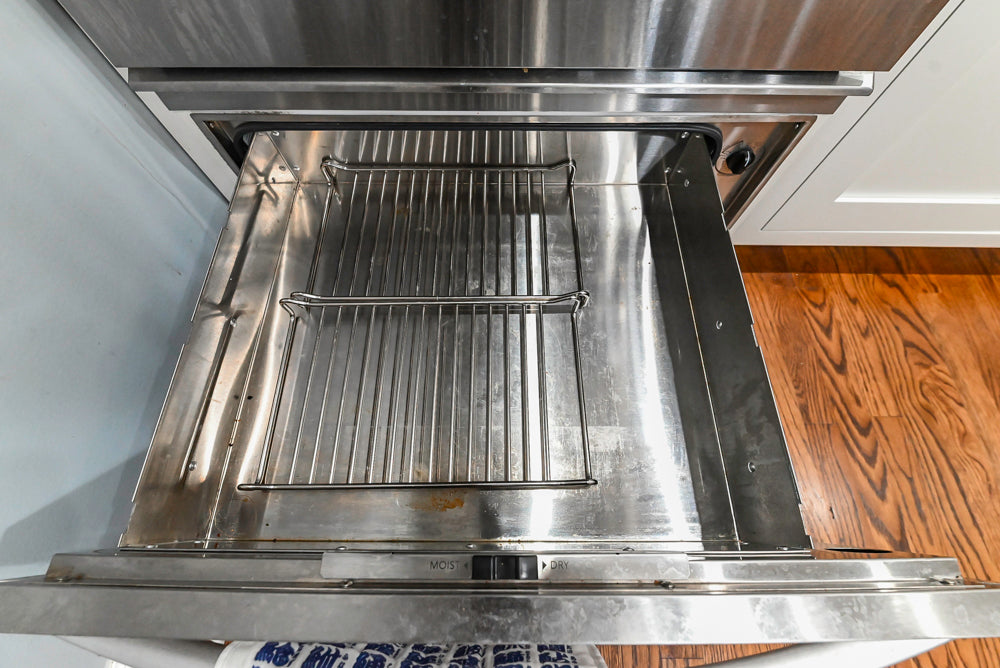 Custom Traditional White Kitchen with Stone Countertops and Appliances