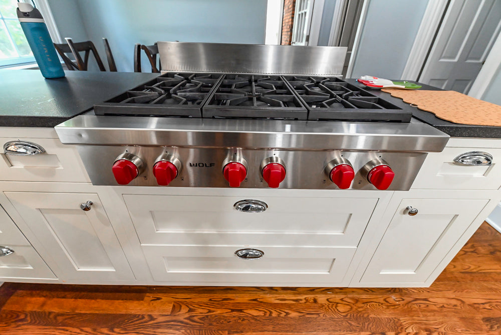Custom Traditional White Kitchen with Stone Countertops and Appliances