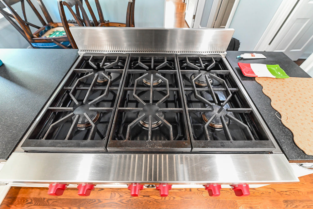 Custom Traditional White Kitchen with Stone Countertops and Appliances