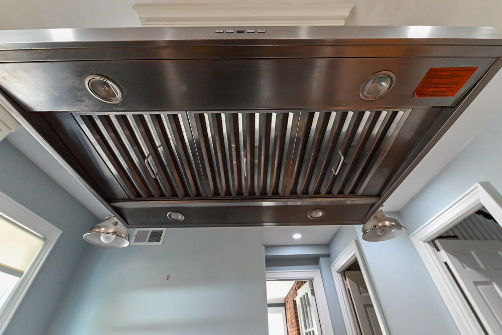 Custom Traditional White Kitchen with Stone Countertops and Appliances