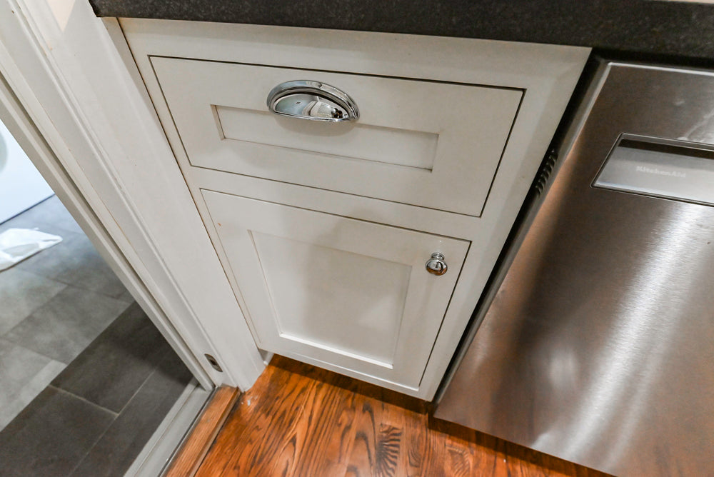 Custom Traditional White Kitchen with Stone Countertops and Appliances