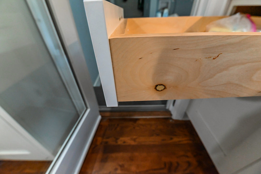 Custom Traditional White Kitchen with Stone Countertops and Appliances