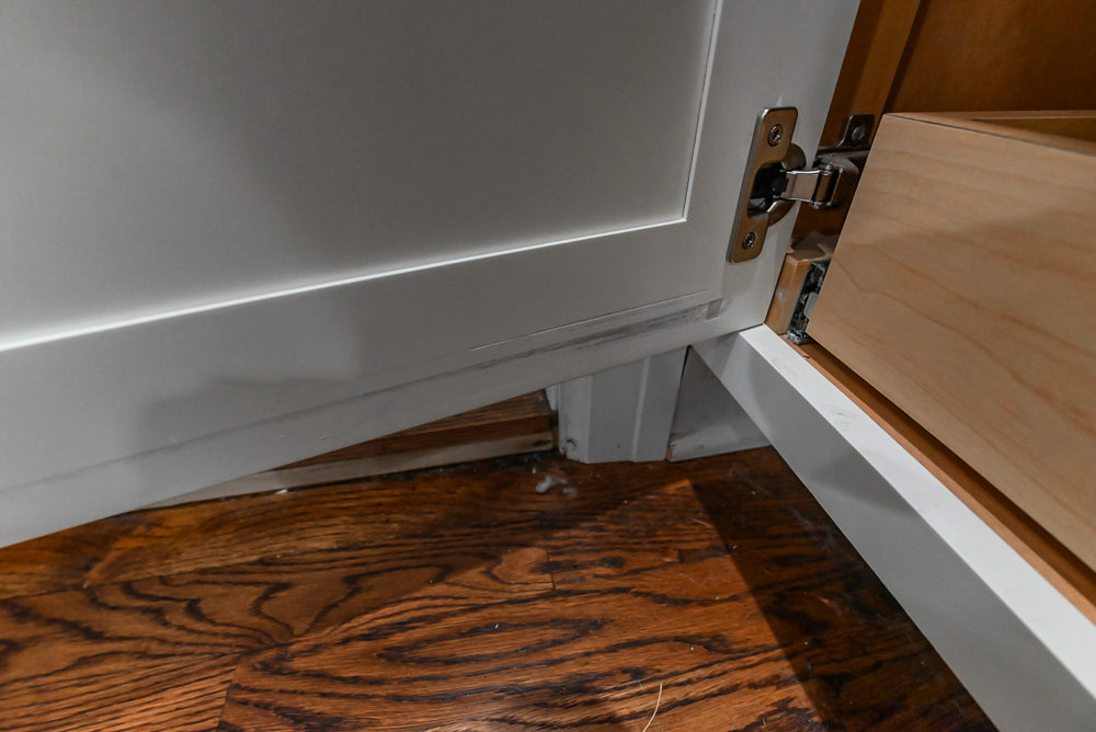 Custom Traditional White Kitchen with Stone Countertops and Appliances