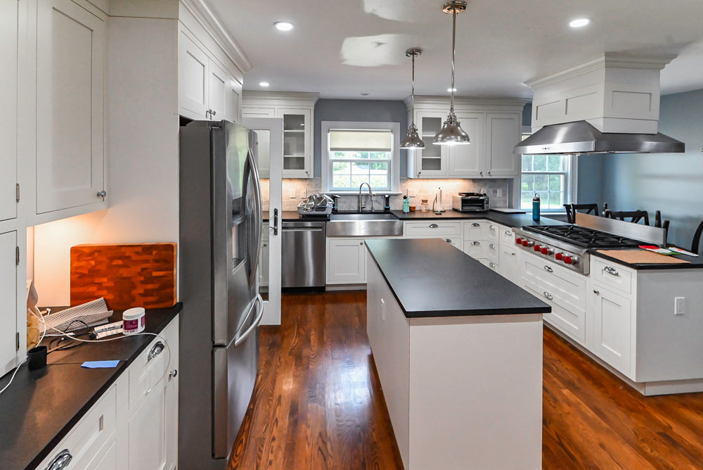 Custom Traditional White Kitchen with Stone Countertops and Appliances