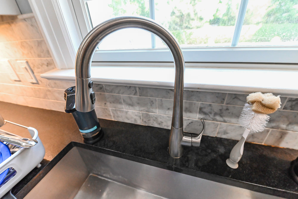 Custom Traditional White Kitchen with Stone Countertops and Appliances
