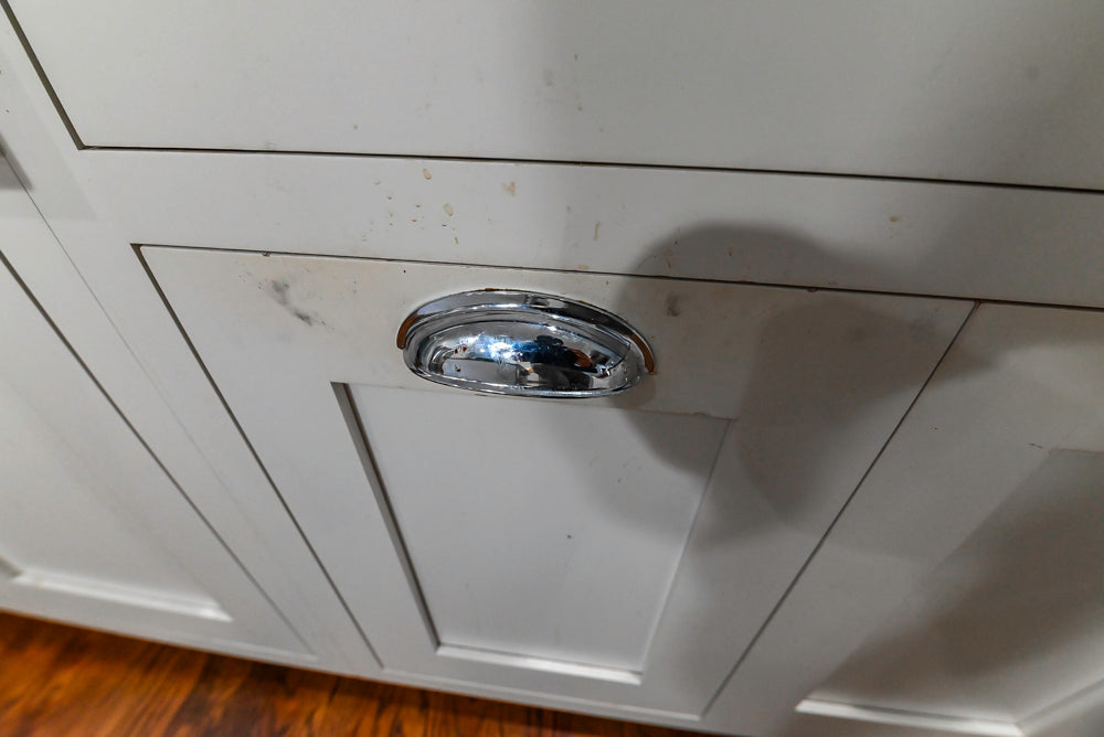 Custom Traditional White Kitchen with Stone Countertops and Appliances