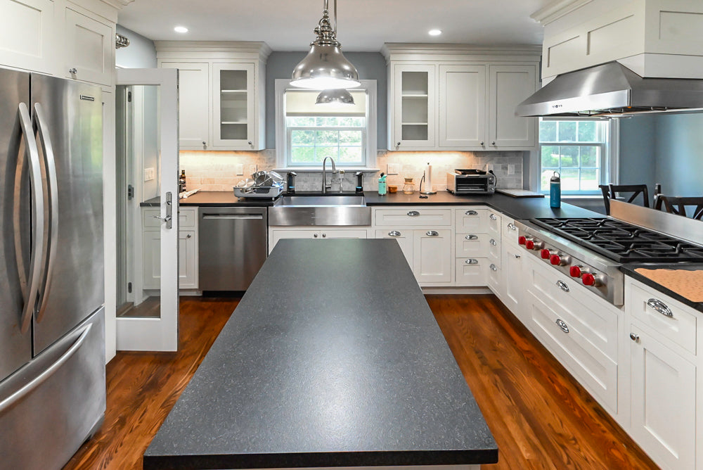 Custom Traditional White Kitchen with Stone Countertops and Appliances