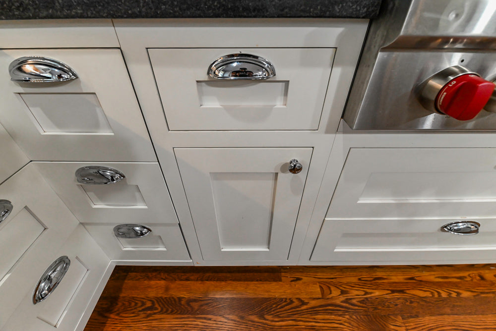Custom Traditional White Kitchen with Stone Countertops and Appliances