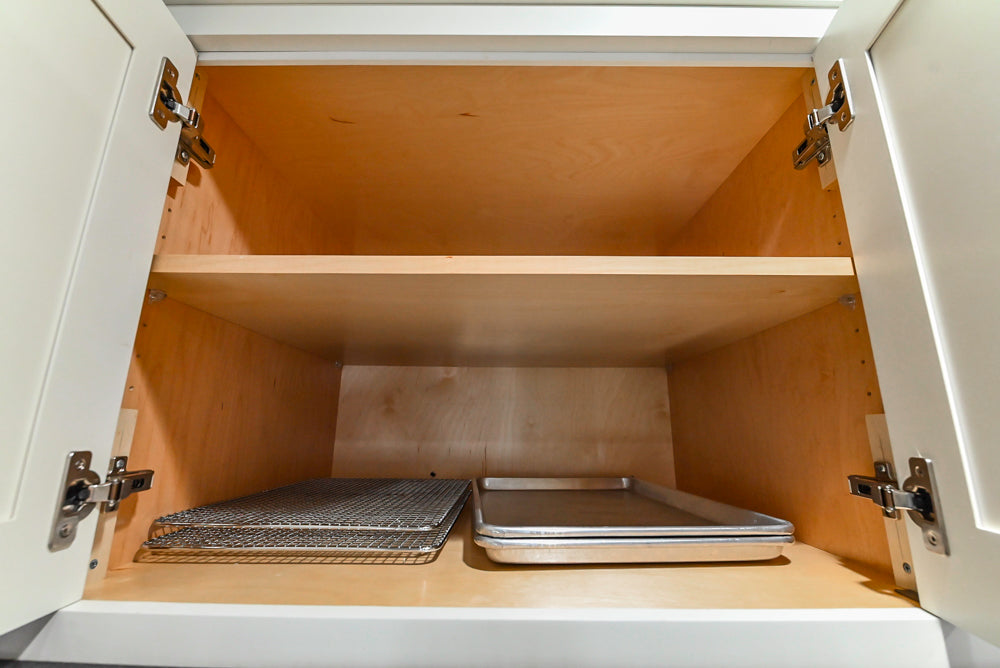 Custom Traditional White Kitchen with Stone Countertops and Appliances