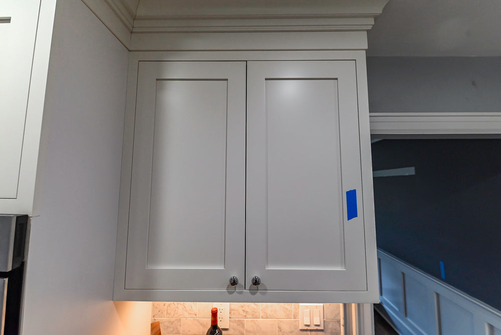 Custom Traditional White Kitchen with Stone Countertops and Appliances