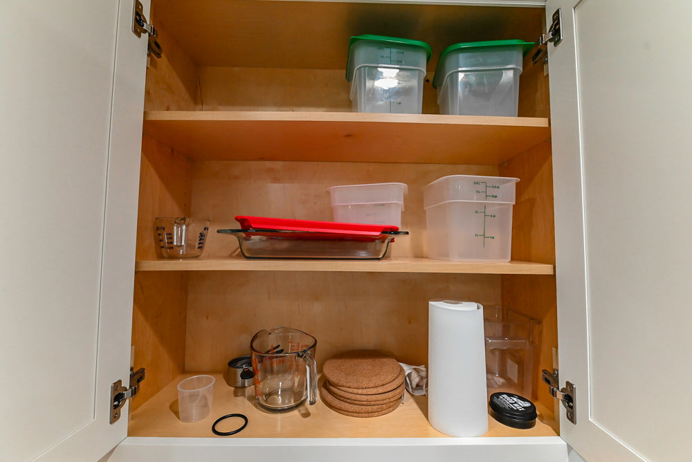 Custom Traditional White Kitchen with Stone Countertops and Appliances