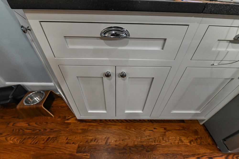 Custom Traditional White Kitchen with Stone Countertops and Appliances