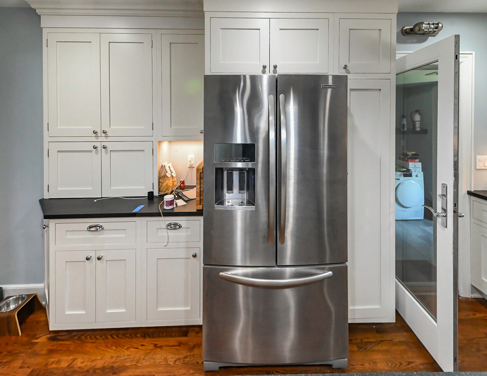 Custom Traditional White Kitchen with Stone Countertops and Appliances