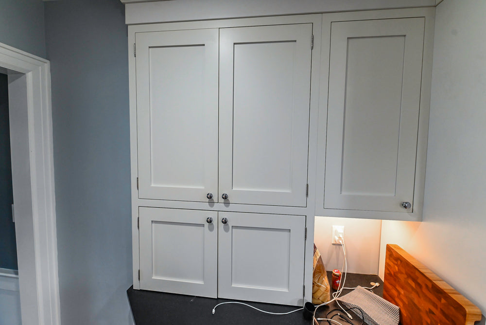 Custom Traditional White Kitchen with Stone Countertops and Appliances