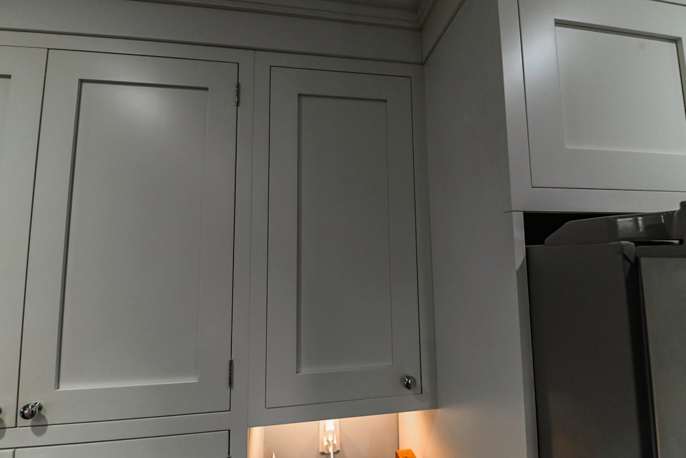 Custom Traditional White Kitchen with Stone Countertops and Appliances