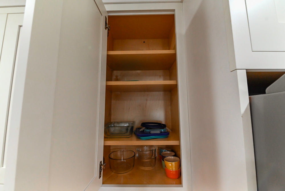 Custom Traditional White Kitchen with Stone Countertops and Appliances