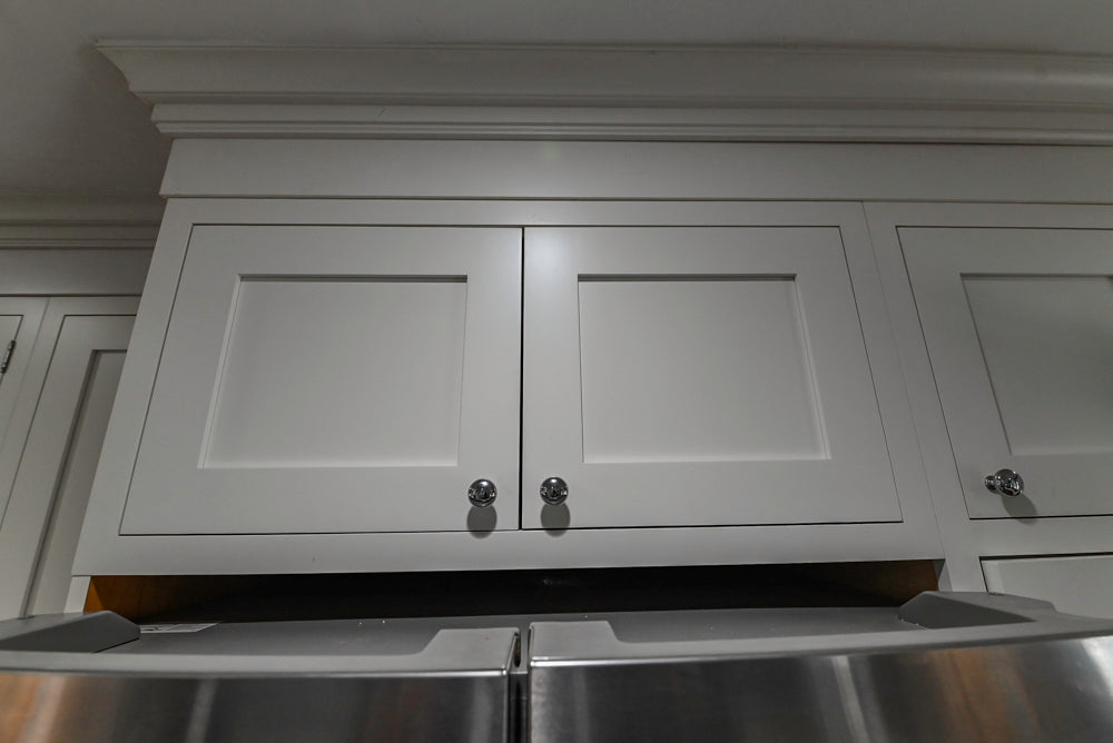 Custom Traditional White Kitchen with Stone Countertops and Appliances