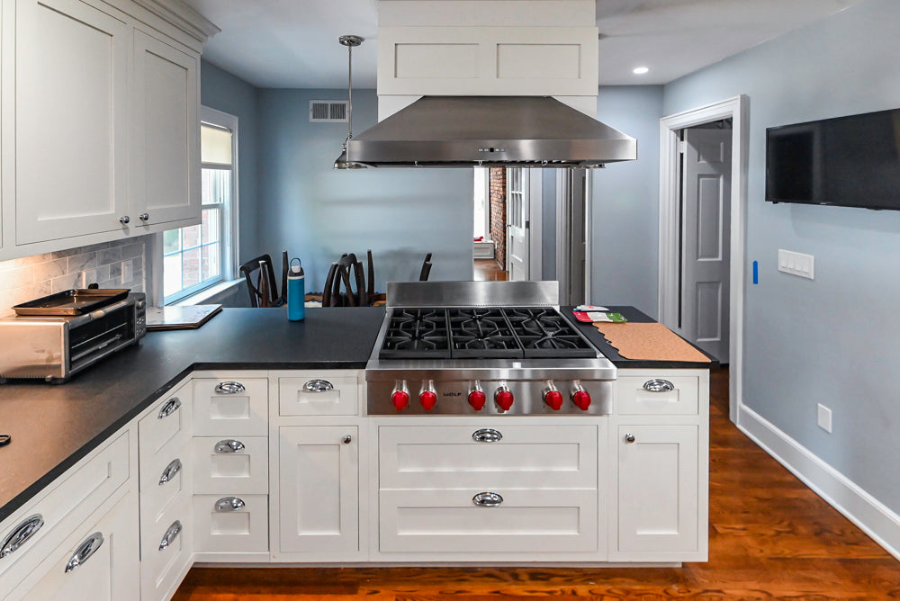 Custom Traditional White Kitchen with Stone Countertops and Appliances