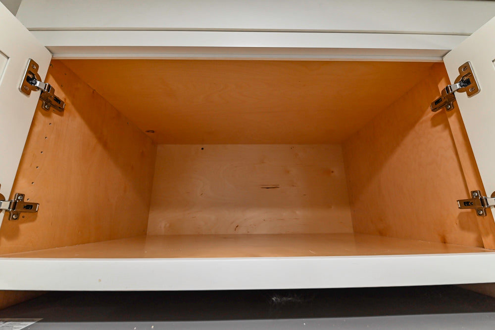 Custom Traditional White Kitchen with Stone Countertops and Appliances