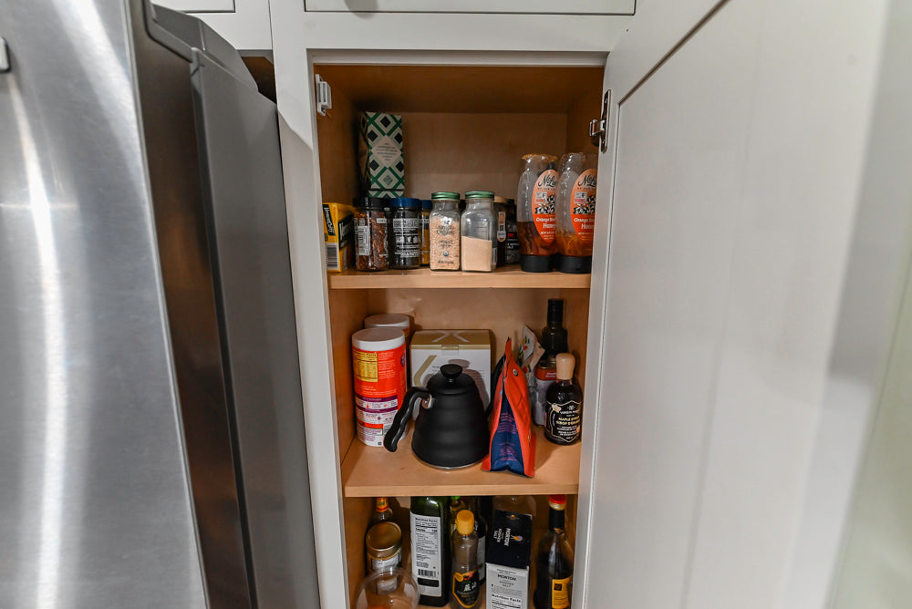 Custom Traditional White Kitchen with Stone Countertops and Appliances