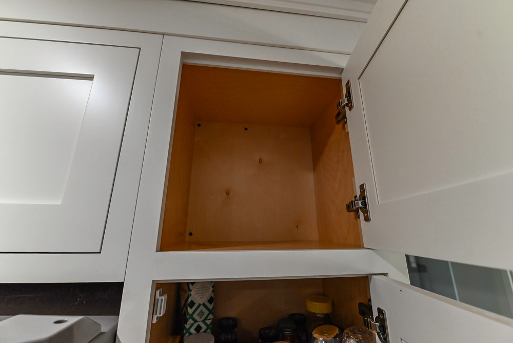 Custom Traditional White Kitchen with Stone Countertops and Appliances