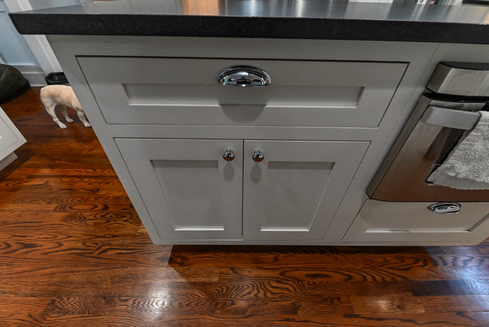 Custom Traditional White Kitchen with Stone Countertops and Appliances
